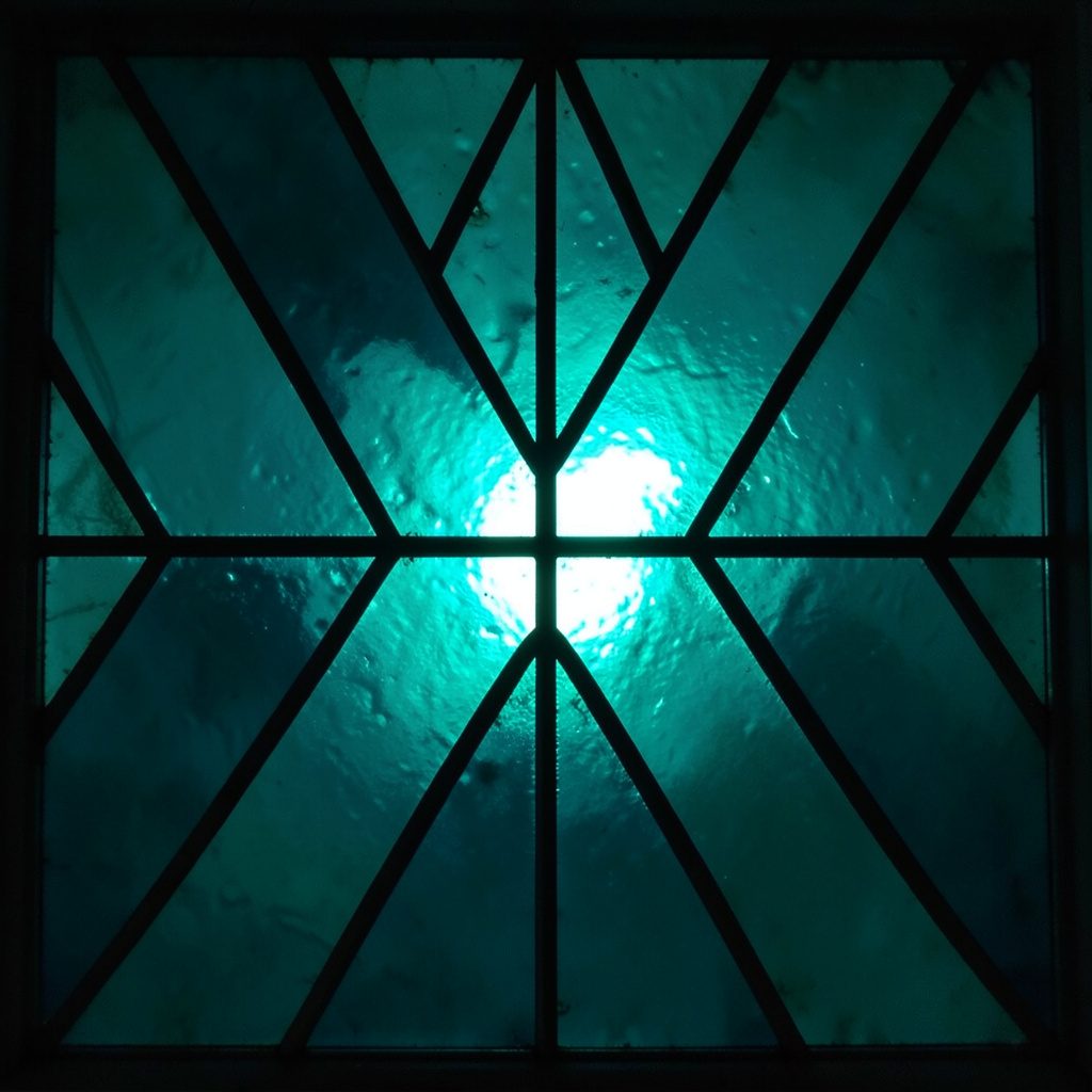Stained glass composition with bold leaded segments in teal, rose pink and amber, soft and luminous mood